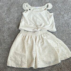 Girl’s cream skirt and tank outfit